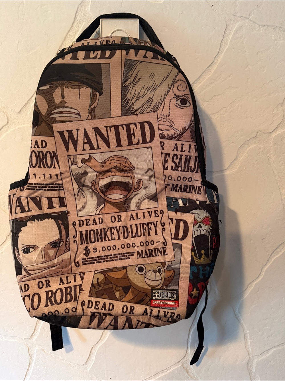 Sprayground Beige and Black One Piece Wanted Poster Backpack